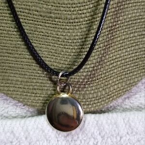 Goldtone solid round disk pendant on black cord necklace